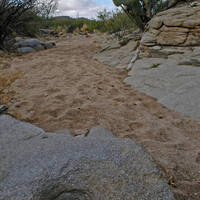Photo: Desert wash with O'odham grinding hole